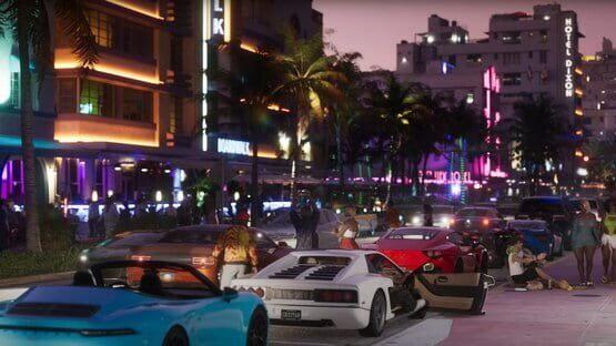A vibrant screenshot from Grand Theft Auto VI (PlayStation 5) shows luxury cars parked along a neon-lit city street at dusk.