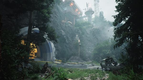 A screenshot from The Lost Wild showing a misty forest scene with a tunnel entrance, a wrecked car, and a building atop a rocky hill.