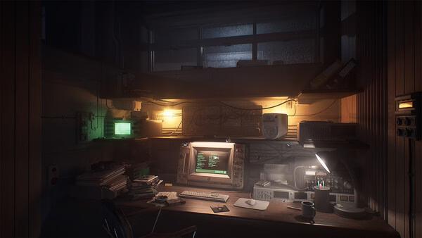 A screenshot from The Lost Wild showing a dimly lit desk with a glowing computer monitor and scattered office items.