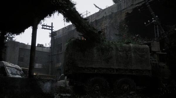 A screenshot from Beautiful Light shows an overgrown, abandoned truck in a decayed industrial courtyard under a gloomy sky.