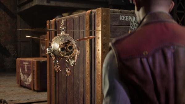 A Clockwork Revolution screenshot showing a steampunk-style flying robot near wooden crates, with a character in the foreground.