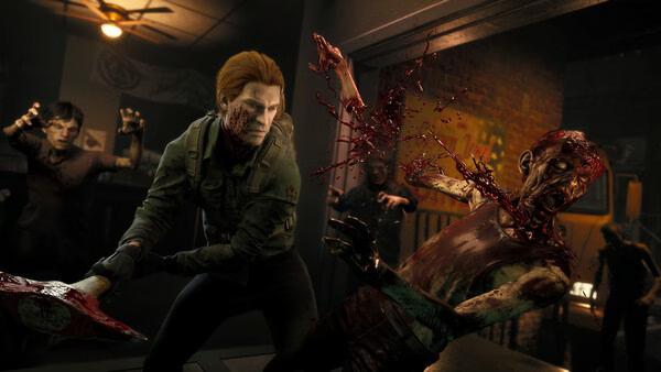 A "No More Room in Hell 2" screenshot showing a survivor attacking a zombie with a bloodied axe as others approach in a dark room.
