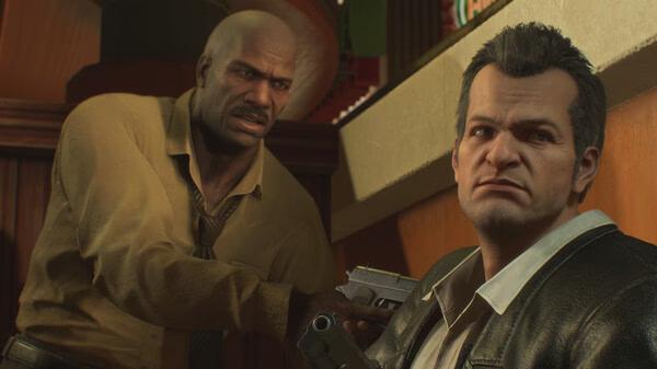 Screenshot from Dead Rising Deluxe Remaster showing two characters in a tense moment, with one holding a gun pointed at the other.