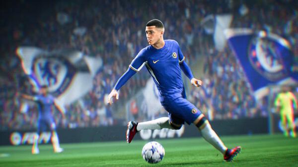 A screenshot from EA SPORTS FC 24 showing a soccer player in a blue jersey kicking a ball in a packed stadium.