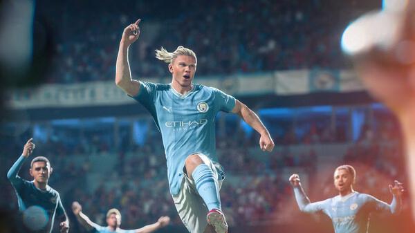 A screenshot from EA SPORTS FC 24 showing a soccer player in a Manchester City kit celebrating a goal on the field.