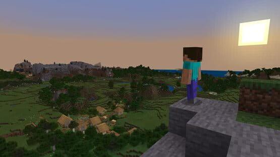A Minecraft: Java Edition screenshot showing a character standing on a cliff, overlooking a village at sunset.
