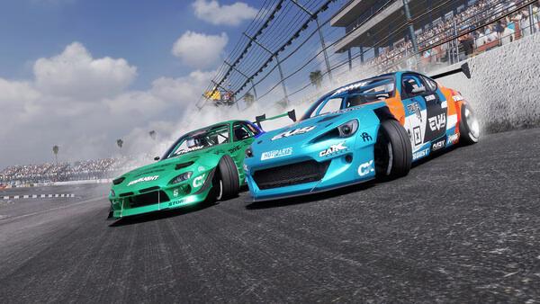Screenshot from CarX Drift Racing Online showing two cars, a green and a blue one, drifting closely on a racetrack.