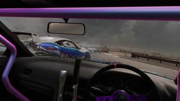 Interior view of a car in CarX Drift Racing Online, showing a lineup of drifting cars on a cloudy track. Game screenshot.