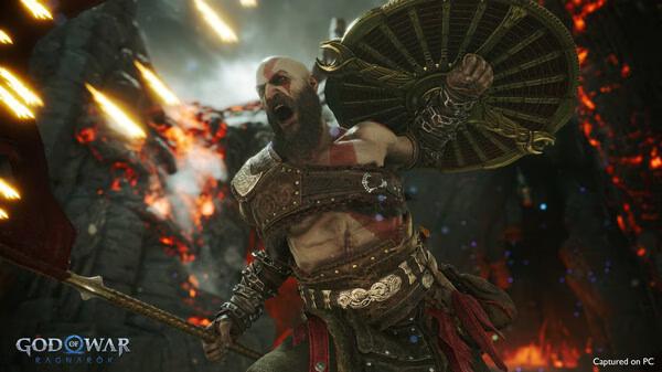 God of War Ragnarök screenshot: A warrior with a shield and axe stands amid fiery explosions and rocky terrain.