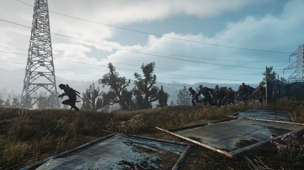 Days Gone screenshot: A lone character runs from a horde of zombies in a grassy field under a cloudy sky near tall power lines.
