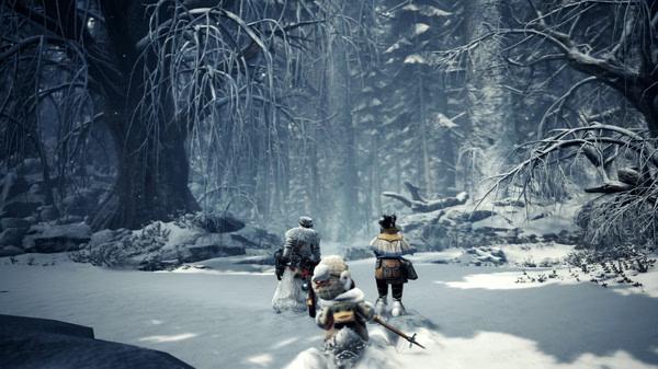 Screenshot from Monster Hunter World: Iceborne Master Edition showing three hunters exploring a snowy forest.