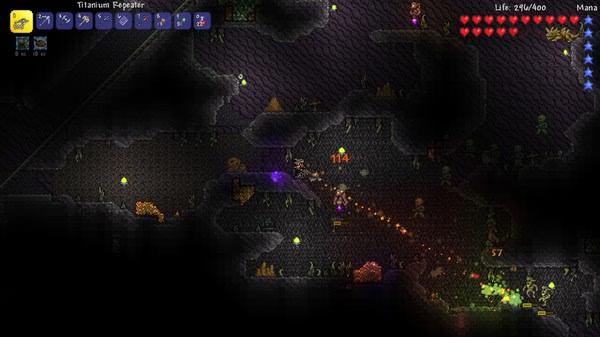Screenshot of Terraria gameplay showing a player battling enemies underground with health and mana bars visible.