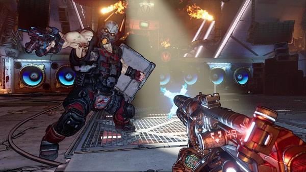 Borderlands 3 screenshot: A player aims a gun at an armored enemy wielding a shield in a fiery, chaotic environment.