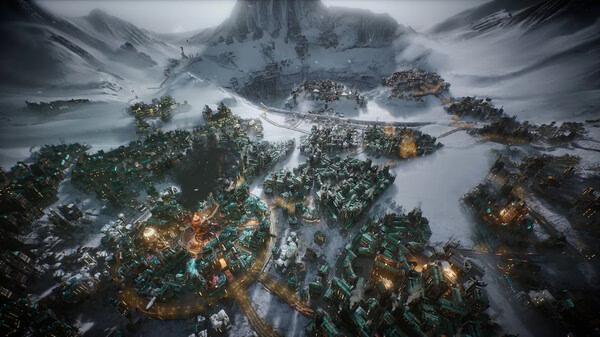 A Frostpunk 2 screenshot showing a snow-covered city with glowing buildings and distant mountains under a cloudy sky.