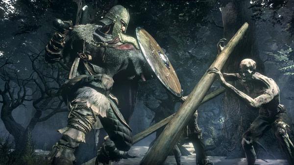 A DARK SOULS™ III screenshot shows a knight with a shield battling two undead enemies in a dark, wooded area.