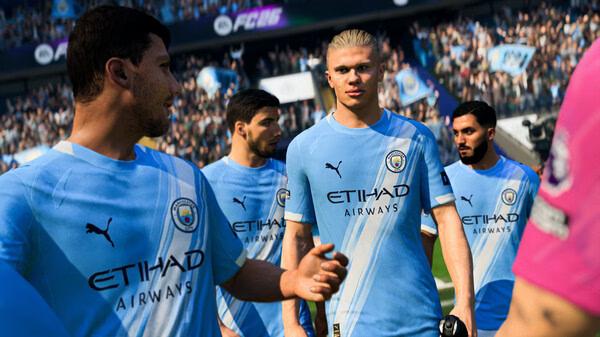 EA SPORTS FC™ 26 screenshot: Soccer players in blue jerseys on the field, with a crowded stadium in the background.