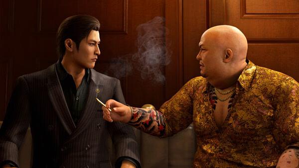 Screenshot from Yakuza Kiwami 3 & Dark Ties shows two characters in conversation, one holding a cigarette with smoke rising.