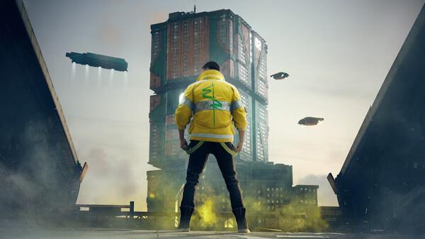 A screenshot from Cyberpunk 2077 shows a character in a yellow jacket facing a towering building with flying vehicles in the sky.