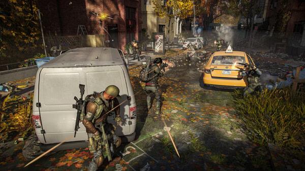 Screenshot from Tom Clancy’s The Division® 2 showing agents in tactical gear taking cover behind vehicles in a city street.