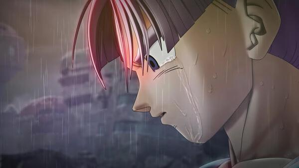 A DRAGON BALL XENOVERSE 2 screenshot showing a close-up of a character with tears in the rain, looking thoughtful and intense.