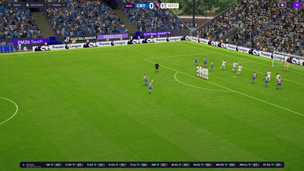 Screenshot from Football Manager 26 showing a free-kick situation with players lined up and fans in the stadium.