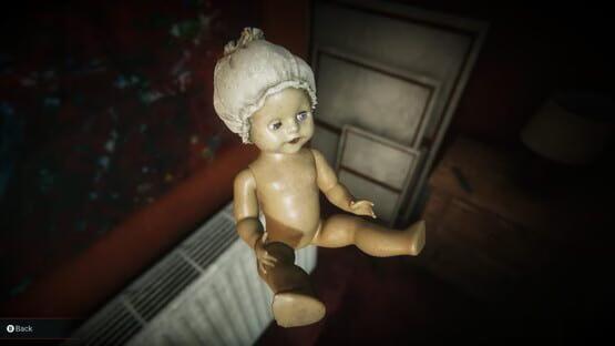 Screenshot from Eternal Threads showing a close-up of a damaged doll with a cloth head in a dimly lit room.