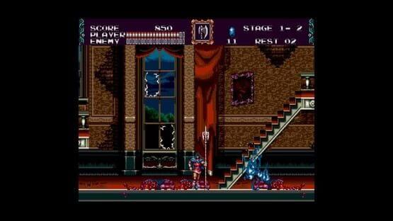 Screenshot from Castlevania Anniversary Collection showing a character battling a blue creature in a castle interior with stairs.