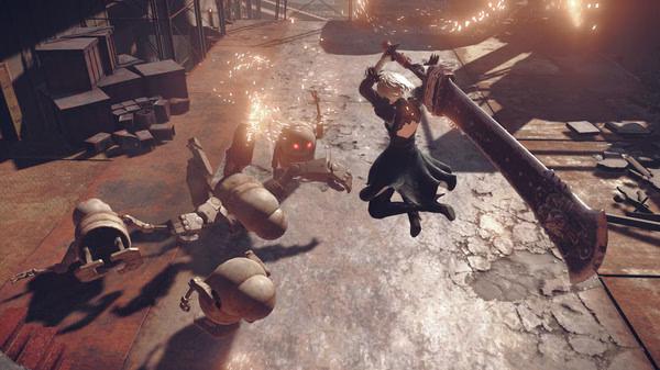 Screenshot from NieR:Automata™ showing a character mid-air attacking robotic enemies on a sunlit, industrial battlefield.