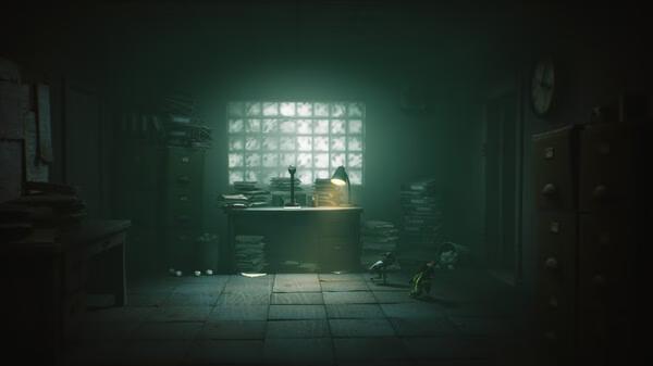 Screenshot from Little Nightmares III showing two small characters exploring a dimly lit, cluttered office with scattered papers.