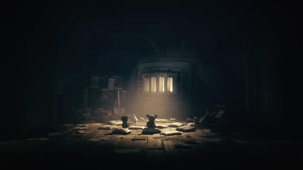 Screenshot from Little Nightmares III showing two small figures facing a large, glowing furnace in a dimly lit room filled with scattered papers.