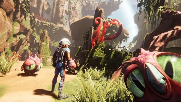 Screenshot from 'Journey To The Savage Planet' showing a character exploring a vibrant alien landscape with red plants and creatures.