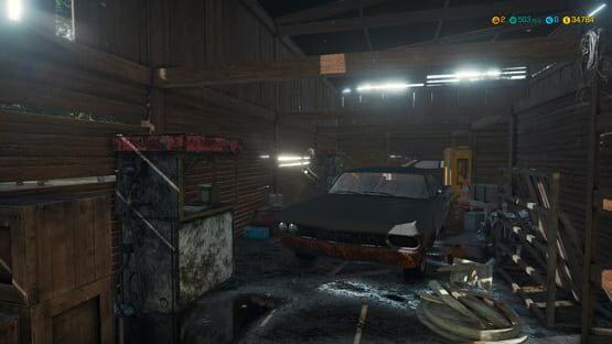 Car Mechanic Simulator 2018 screenshot: A rundown garage with an old car, tools, and equipment scattered around.