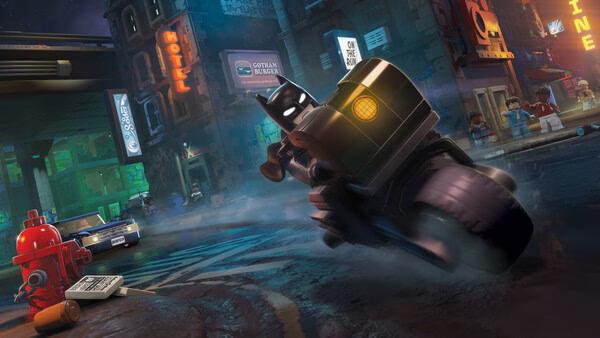 Batman rides a motorcycle through a rainy city street in this screenshot from LEGO® Batman™: Legacy of the Dark Knight.