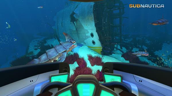 Subnautica screenshot: View from a submarine cockpit showing diverse sea life and a sunken ship in deep blue ocean waters.