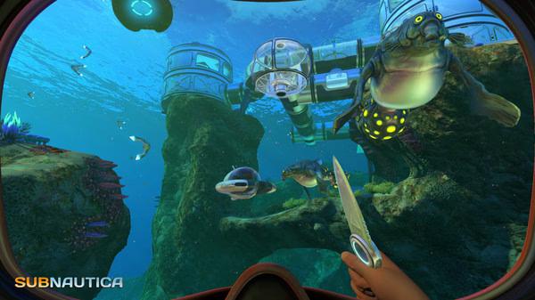 Subnautica screenshot: A player's hand holding a knife while facing three marine creatures near an underwater base with tube structures.