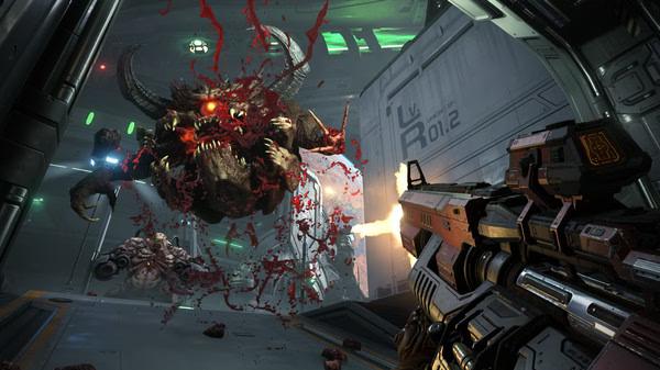 DOOM Eternal screenshot: A player fires at a monstrous demon in a sci-fi corridor, with debris and blood in the air.