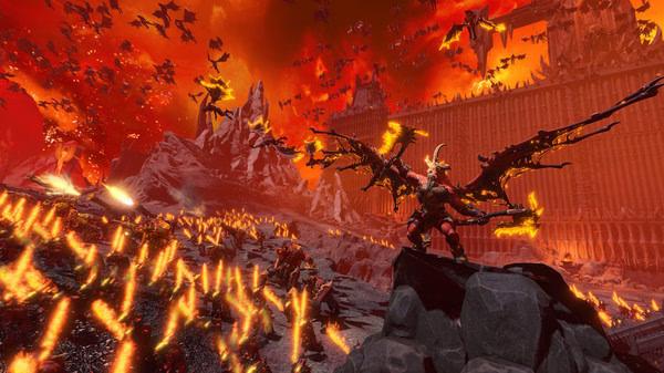 Screenshot from Total War: WARHAMMER III showing a winged demon amidst a fiery battlefield with mountains and fortress walls in the background.