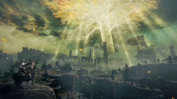 Elden Ring screenshot: A warrior on horseback gazes at a vast landscape dominated by a glowing, ethereal tree under a dramatic sky.
