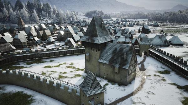 Screenshot from Manor Lords showing a fortified medieval town with snow-covered rooftops and surrounding forest.