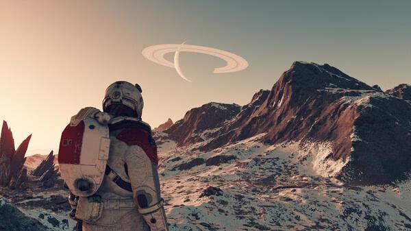Starfield screenshot: An astronaut stands on a snowy landscape, gazing at distant mountains and a ringed planet in the sky.