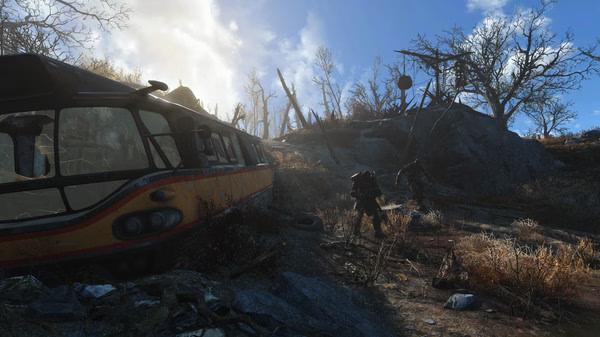 A Fallout 4 screenshot showing a damaged bus in a desolate landscape, with two armored figures walking nearby under a bright sky.
