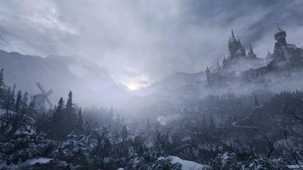 Resident Evil Village screenshot showing a foggy landscape with a castle on a hill, windmill, snowy trees, and distant mountains.
