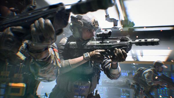 Screenshot from Battlefield™ 2042 showing soldiers in combat gear aiming rifles inside a futuristic building.