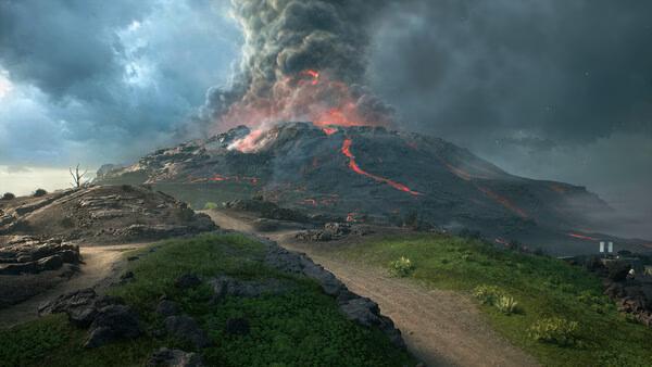 Battlefield™ 2042 screenshot: A rocky landscape with a volcano spewing smoke and lava under a dramatic sky.