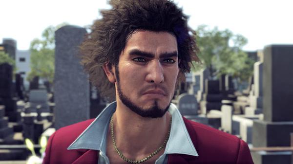 Yakuza: Like a Dragon screenshot of a character with curly hair wearing a red jacket in a cemetery setting.