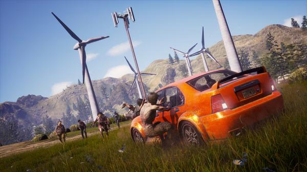 Screenshot from State of Decay 2: Juggernaut Edition showing zombies attacking an orange car near wind turbines in a grassy field.