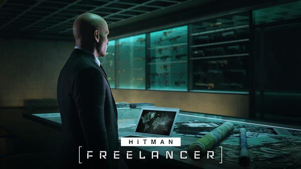 A HITMAN World of Assassination screenshot showing Agent 47 in a room with weapon displays, standing at a table with a laptop.