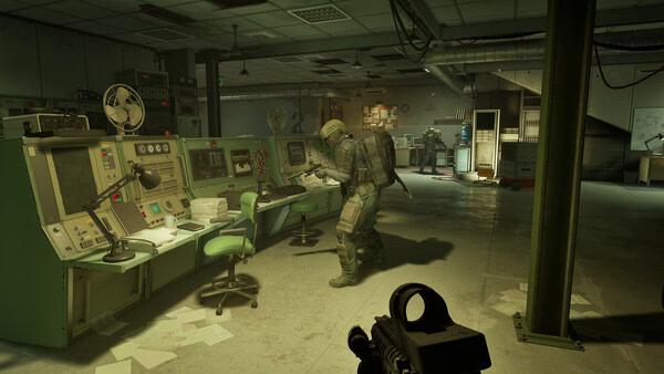PUBG: Black Budget screenshot showing a soldier in tactical gear examining equipment in a dimly lit control room.
