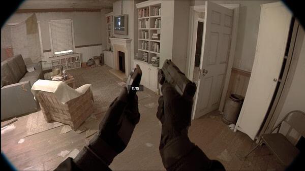 Unrecord screenshot: A pair of gloved hands holding a handgun in a dimly lit room with furniture and bookshelves.