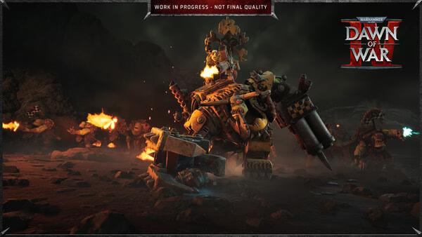 Warhammer 40,000: Dawn of War IV screenshot showing heavily armored warriors battling in a dark, rocky terrain.